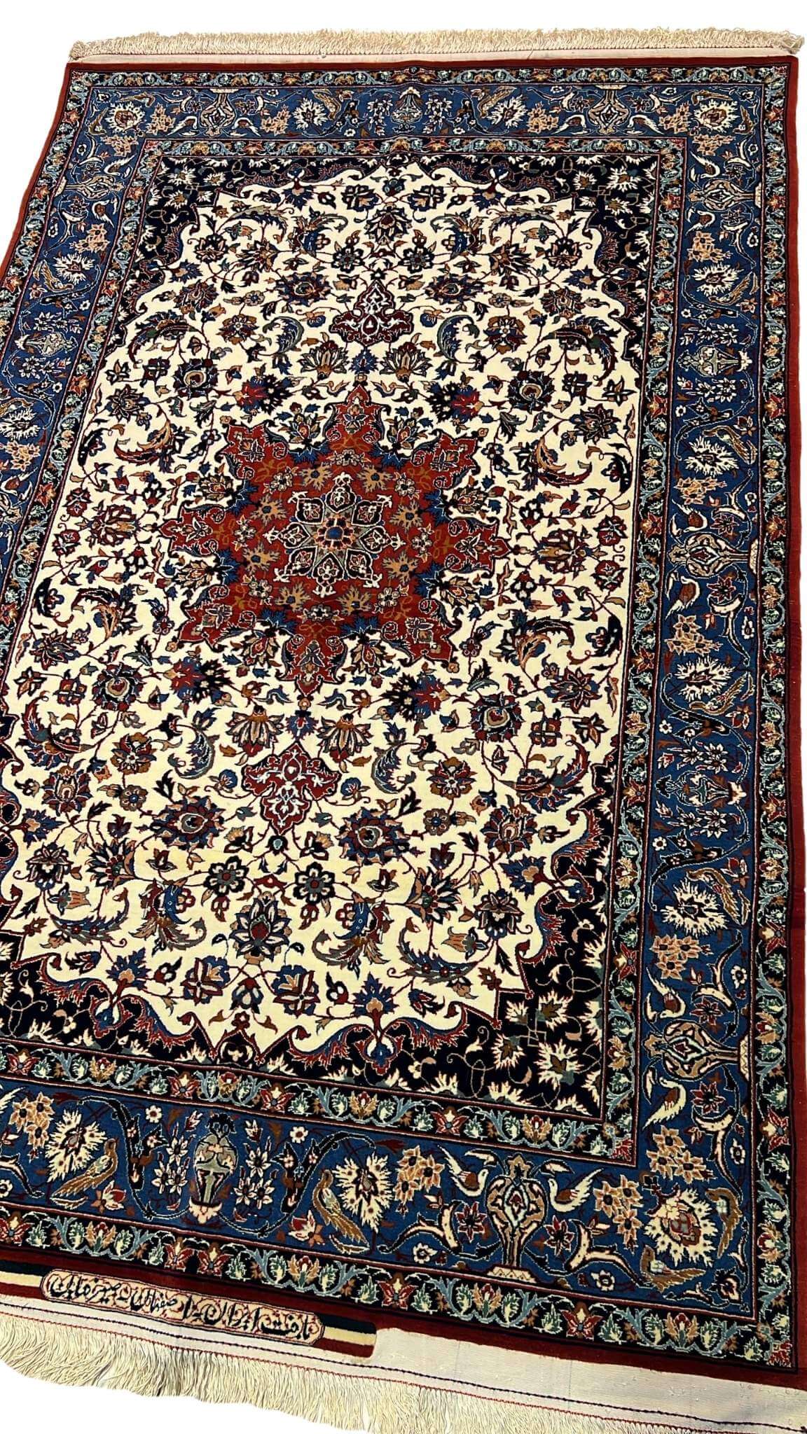 "Isfahan Seirafian rug by Master Ahmad Seirafian, showcasing detailed craftsmanship with wool and silk pile."